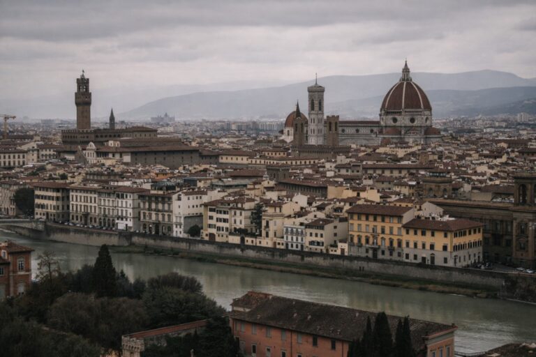 Florence skyline with the Duomo and Arno River under overcast winter light.