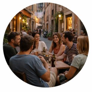 Group of people in their 30s and 40s sitting at a neighborhood café in Italy.