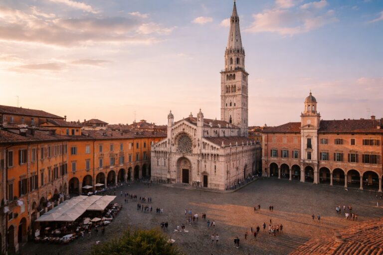 Modena Cathedral and Ghirlandina tower in Piazza Grande with surrounding porticoes