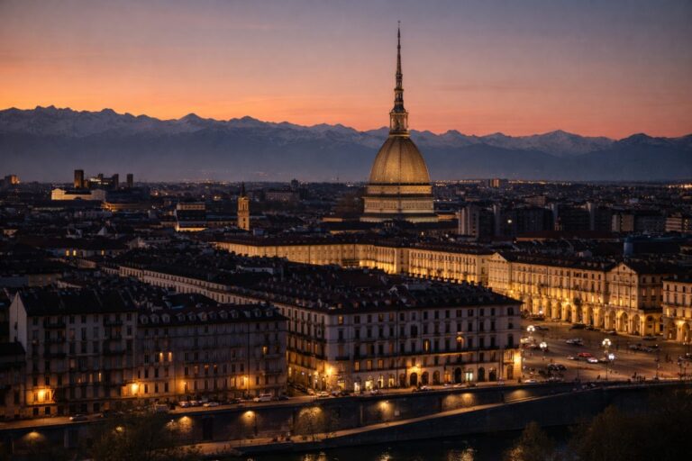 Torino cityscape at dusk with the Mole Antonelliana and the Alps in the background
