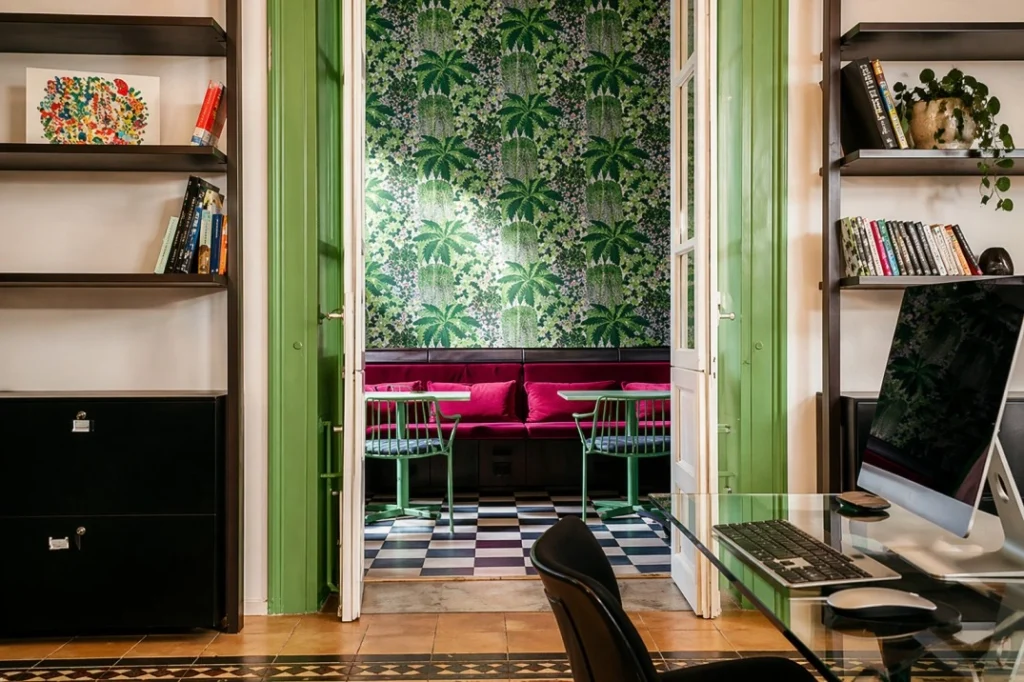Coworking and lounge space at Beet Community Agrigento Palermo with tropical interiors and shared workspace