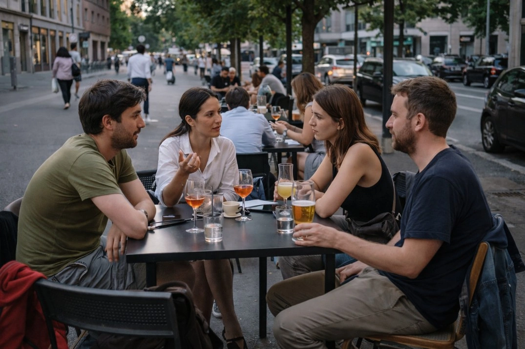 Community in Milan, Italy – small group talking at an informal shared table