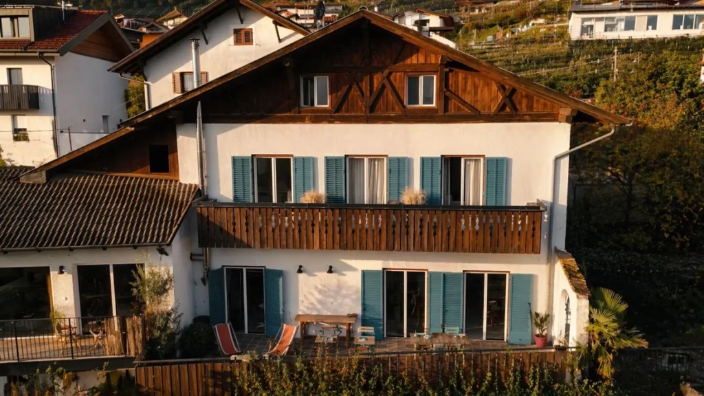 Franz & Mathilde coliving house in Bolzano with alpine architecture and shared outdoor terrace