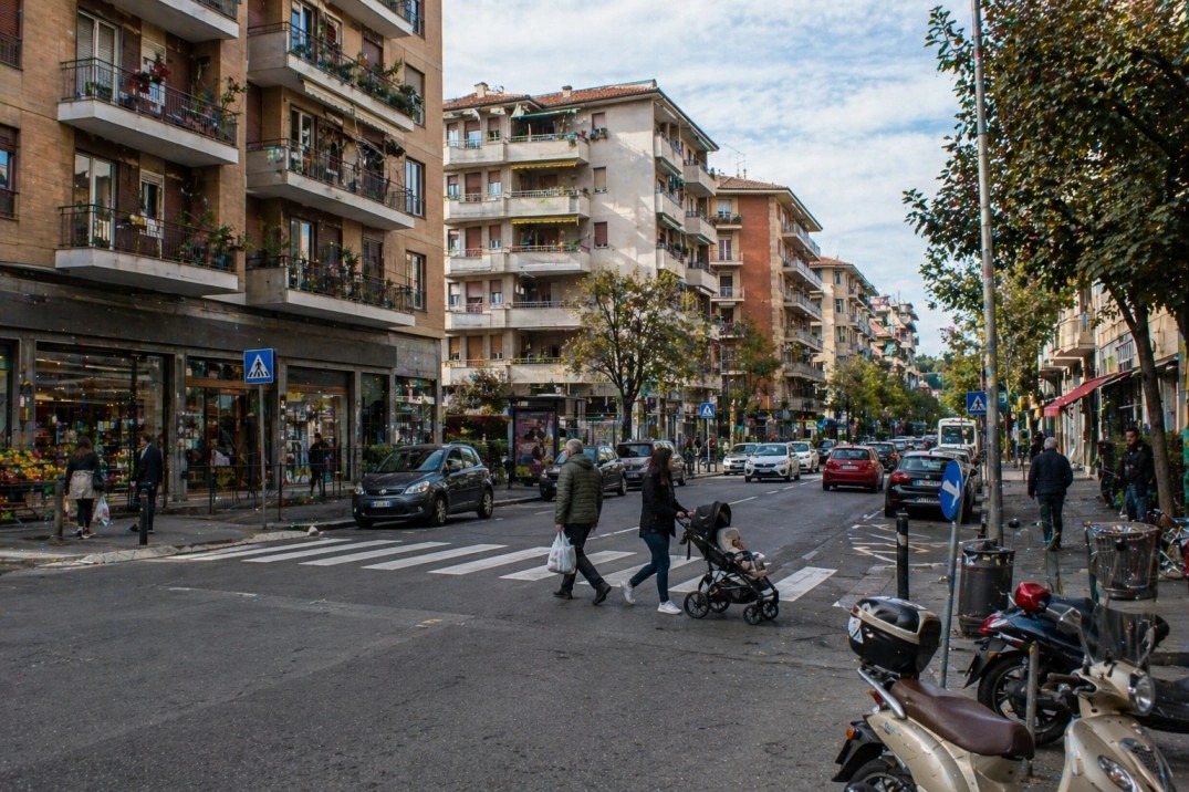 Gavinana in Florence, Italy – residential services street with shops and cars
