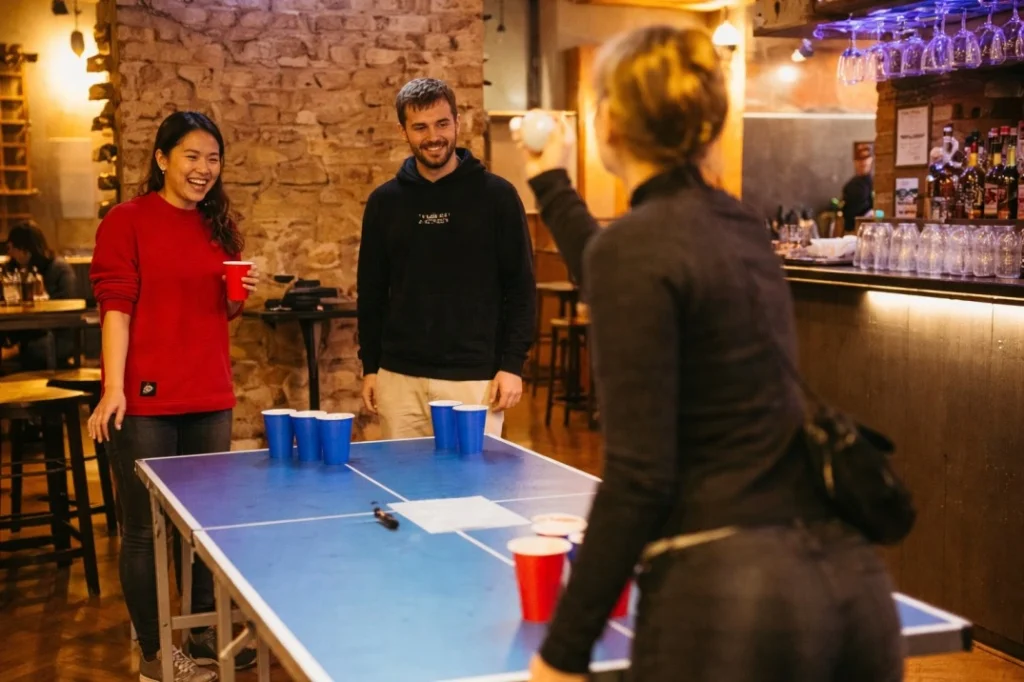 QUO Milan shared social space with people playing table tennis and informal interaction