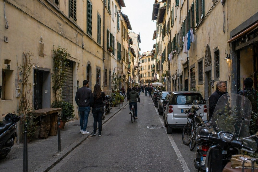 San Frediano in Florence, Italy – residential artisan street with scooters and local shops