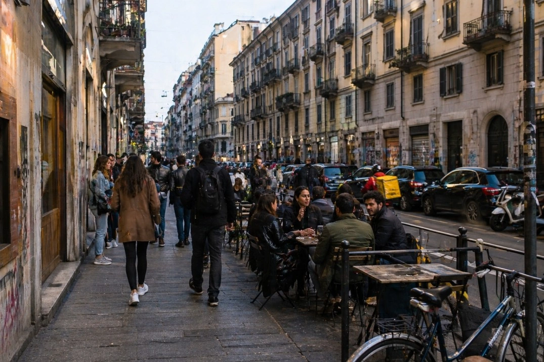 San Salvario Torino in Torino, Italy – mixed street life near bars and apartments