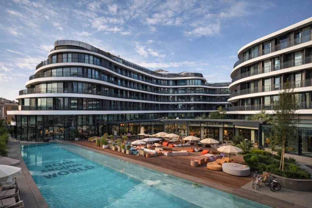 The Social Hub Rome coliving building with pool courtyard and outdoor work areas