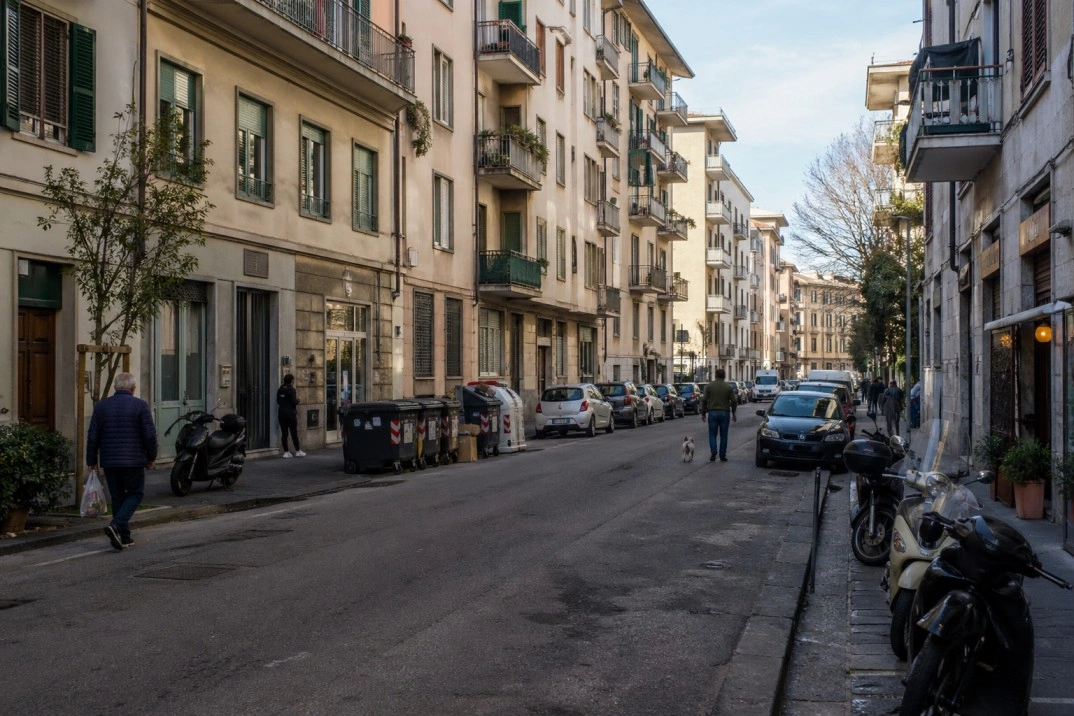 Where to live in Florence, Italy – residential street with apartments and parked scooters
