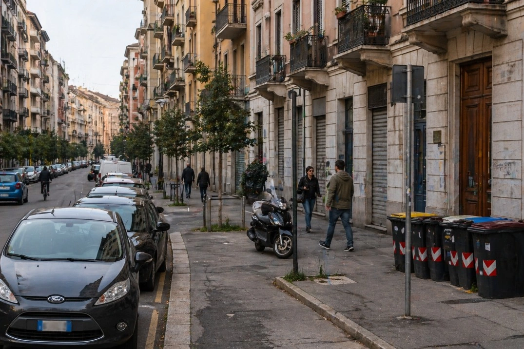Where to live in Torino, Italy – residential street with apartments and parked cars